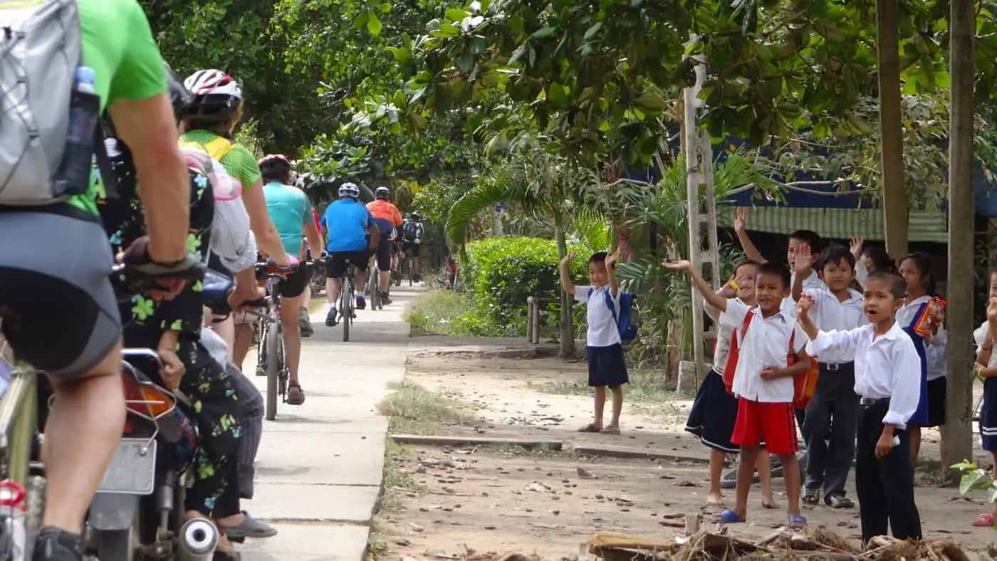 waving school kids